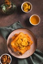 Caramelized bananas with nuts on fried bread on a dessert plate on the table top and vertical view Royalty Free Stock Photo