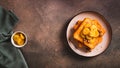 Caramelized bananas with nuts on fried bread on a dessert plate on the table top view web banner Royalty Free Stock Photo