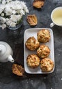 Caramelized cinnamon apples muffins, green tea, bouquet of chrysanthemums on a dark background, top view. Dessert table Royalty Free Stock Photo