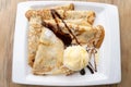 Caramelized condensed milk crepes plate with vanilla ice cream and chocolate