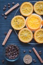 Caramelized oranges, cinnamon, candle and coffee beans Royalty Free Stock Photo