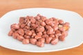 Caramelized Peanuts on white plate Royalty Free Stock Photo