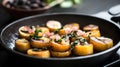 Caramelized plantains in iron skillet with fresh herbs and diced vegetables Royalty Free Stock Photo
