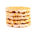 Caramelized rice-corn crispbread, isolated on white background. Sweet puffed whole grain crispbread.