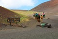 Caravan of camels with tourists in Timanfaya National Park, Lanzarote, Canary Islands