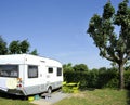 Caravan at a camping with blue sky Royalty Free Stock Photo