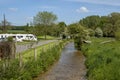 Caravan campsite on riverside. England, UK.