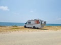 caravan car by the beach in summer holidays modern