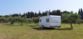 Caravan car by the sea in summer beach trees blue sky Royalty Free Stock Photo