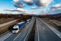 Caravan or convoy of lorry trucks on country highway Royalty Free Stock Photo