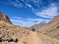 Caravan of mules carrying goods and luggage to Djebel Toubkal, High Atlas Mountain, Morocco. Royalty Free Stock Photo