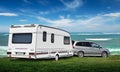 The caravan stands on the Vedic lawn by the sea. Royalty Free Stock Photo