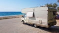 Caravan trailer car by the sea in summer holidays Royalty Free Stock Photo