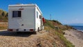 Caravan trailer car by the sea in summer holidays Royalty Free Stock Photo