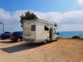 Caravan trailer car by the sea in summer holidays Royalty Free Stock Photo