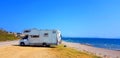 Caravan trailer car by the sea in summer holidays