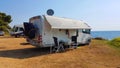 Caravan trailer car by the sea in summer holidays Royalty Free Stock Photo