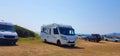 Caravan trailer car by the sea in summer holidays Royalty Free Stock Photo