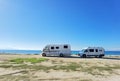 Caravans cars beside sea beach in autumn greece