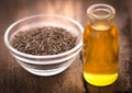 Caraway seeds with essential oil in glass bottle Royalty Free Stock Photo