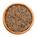 Caraway seeds in a wooden bowl over white