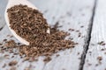 Caraway on a wooden spoon