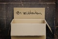 Carboard box with german inscription `zu verschenken` meaning Free Stuff.