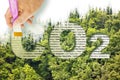 From carbon dioxide to oxygen - CO2 Net-Zero Emission - Carbon Neutrality concept against a forest with removing letter C from CO2