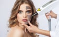 Carbon face peeling procedure in a beauty salon. Royalty Free Stock Photo