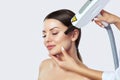 Carbon face peeling procedure in a beauty salon. Hardware cosmetology Royalty Free Stock Photo