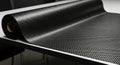 Carbon fiber roll on table surface highlighting modern technology material for industrial and automotive use. concept of advanced Royalty Free Stock Photo