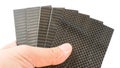 Carbon fiber specimen sample plate on his hand Royalty Free Stock Photo
