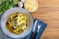 Carbonara pasta dish, typical Italian recipe with parmesan cheese, egg cream and bacon. Top view. Space for text Royalty Free Stock Photo