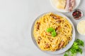 Carbonara pasta, spaghetti with bacon, egg, hard parmesan cheese and basil in a plate. Traditional italian cuisine Royalty Free Stock Photo