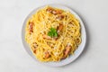 Carbonara pasta, spaghetti with guanciale, egg, hard parmesan cheese and parsley. Traditional italian cuisine