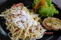 Carbonara spaghetti serving with garlic bread Royalty Free Stock Photo