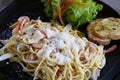 Carbonara spaghetti serving with garlic bread Royalty Free Stock Photo