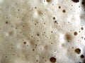 Carbonated drink foam close up with small bubbles texture Royalty Free Stock Photo