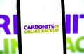 Carbonite logo on smartphone screen.