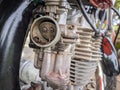 carburetor & motorcycle engine on defocused background