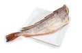 Carcass of the uncooked red cod on white dish Royalty Free Stock Photo