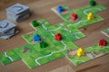 Carcassonne board game being played on a table top