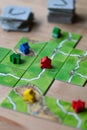 Carcassonne board game being played on a table top Royalty Free Stock Photo