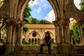 Carcassonne, France - 2019. Fontfroide Abbey monastery in France.Young male tourist looking at the medieval gothic monastery,