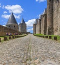 A street in Carcassone Old Town with small touristic shops and cafe