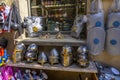 Carcassonne, France - 02.07.2021: Medieval helmets, Toy wooden swords for sale in a toyshop. Shop of tourist souvenirs