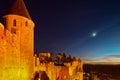 Carcassonne medieval fortress highlighted night view with moon i Royalty Free Stock Photo