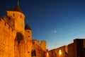 Carcassonne medieval fortress highlighted night view with moon i Royalty Free Stock Photo