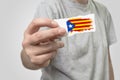 Card with Catalonia flag in hand. Royalty Free Stock Photo