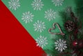 christmas tree and decorations, top view, on a green and red background, snowflakes and lollipop , cane light in claus Royalty Free Stock Photo